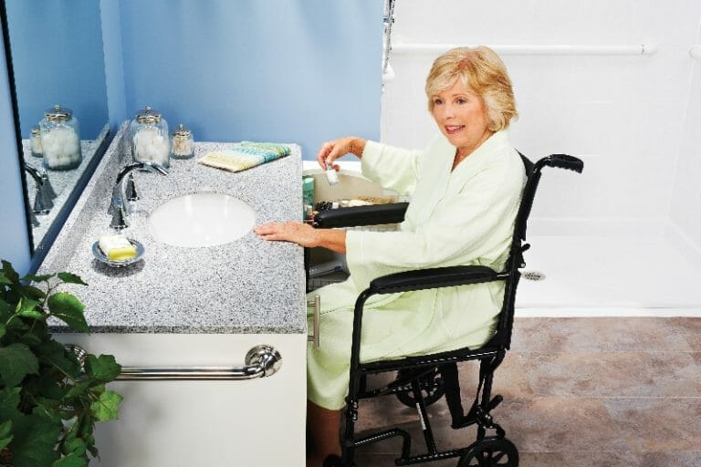 Woman in a Wheelchair at the Sink