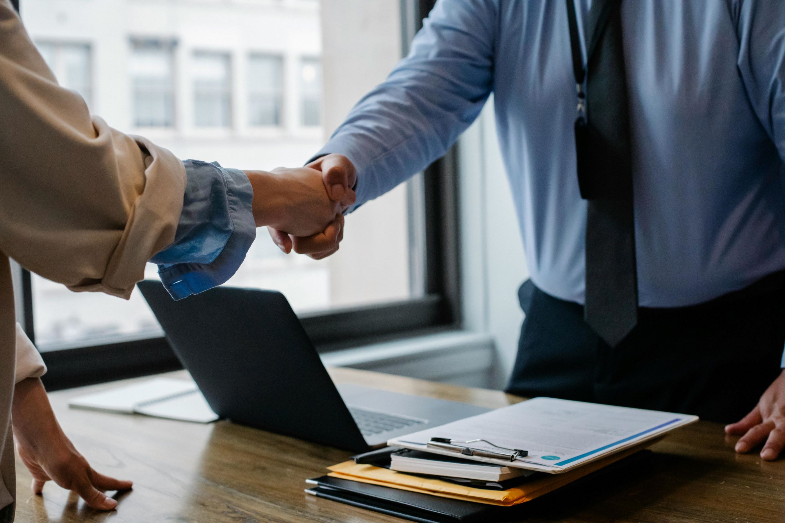 Two People Shaking Hands