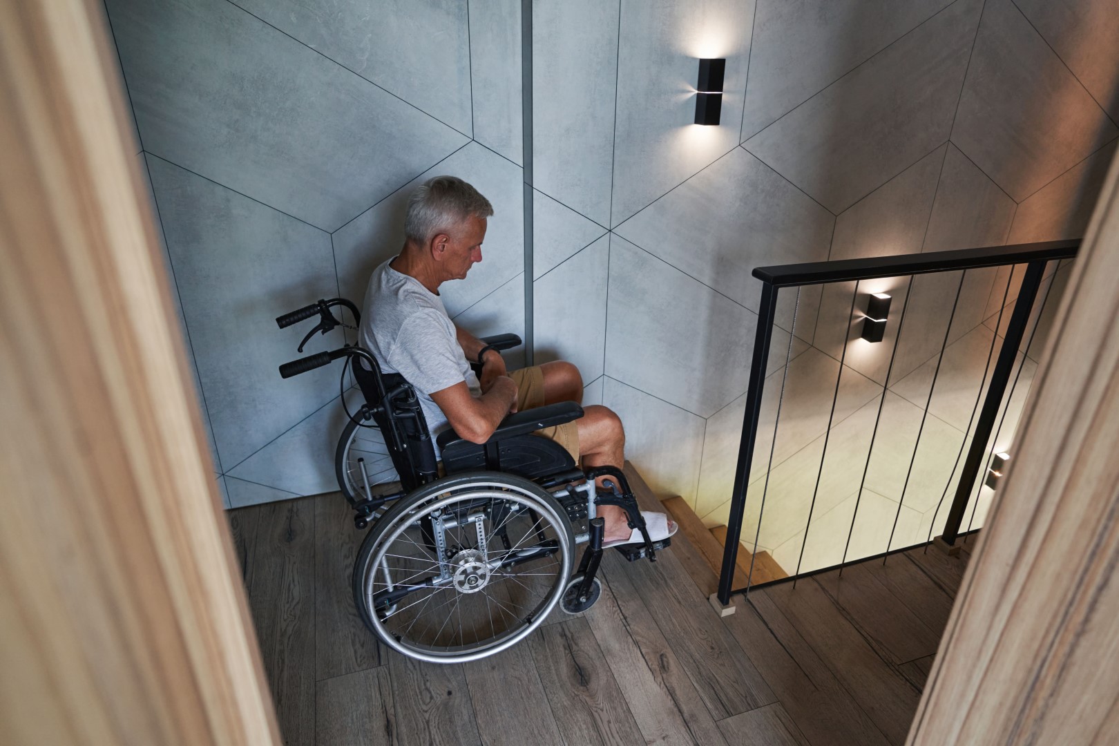 Man In Wheelchair By Stairs