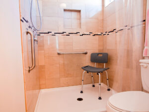  A handicap accessible shower stall in a home. 